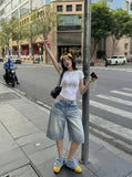 DAXUEN Light blue wide-leg denim culotte shorts — model photo
