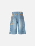 Light blue wide-leg denim culottes with abstract patterns