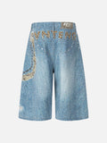 Light blue wide-leg denim culottes with abstract patterns
