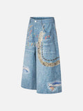 Light blue wide-leg denim culottes with abstract patterns