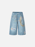 Light blue wide-leg denim culottes with abstract patterns