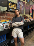DAXUEN light cream double-layered athletic shorts — model photo