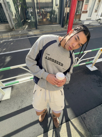 DAXUEN light cream double-layered athletic shorts — model photo