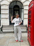 DAXUEN light grey wide-leg pants with front buttons — model photo