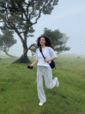 DAXUEN light grey wide-leg pants with front buttons — model photo
