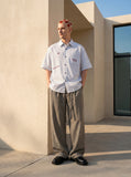 DAXUEN Light-coloured short-sleeved button-down shirt — model photo