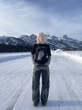 DAXUEN Men's distressed long-sleeve t-shirt with layered design — model photo
