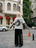 DAXUEN Men's distressed long-sleeve t-shirt with layered design — model photo
