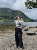 DAXUEN Men's distressed long-sleeve t-shirt with layered design — model photo
