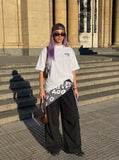 DAXUEN Oversized short-sleeved t-shirt with script graphics — model photo