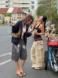 DAXUEN Loose-fitting cargo shorts with distressed graphics — model photo