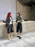 DAXUEN Men's loose-fit denim cargo shorts — model photo