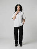 DAXUEN Loose-fitting short-sleeved polo shirt with embroidery — model photo