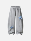 Loose-fitting wide leg sweatpants with star appliqué