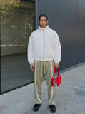 DAXUEN Loose-fitting track pants with snap buttons and stripes — model photo
