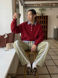 DAXUEN Loose-fitting track pants with snap buttons and stripes — model photo