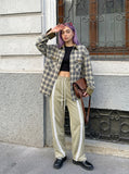 DAXUEN Loose-fitting track pants with snap buttons and stripes — model photo