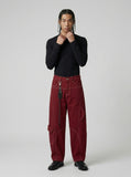 DAXUEN Wide-leg trousers with pockets and keychain accessory — model photo