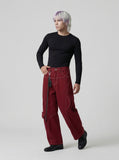 DAXUEN Wide-leg trousers with pockets and keychain accessory — model photo