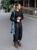 DAXUEN Wide-leg trousers with pockets and keychain accessory — model photo