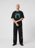 DAXUEN white oversized human head silhouette graphic tee — model photo
