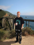 DAXUEN white oversized human head silhouette graphic tee — model photo