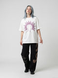 DAXUEN white oversized human head silhouette graphic tee — model photo
