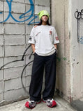 DAXUEN Oversized embroidered t-shirt with graphics — model photo