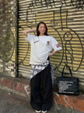 DAXUEN Oversized embroidered t-shirt with graphics — model photo