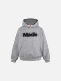 DAXUEN Oversized striped hoodie with 'Made' text