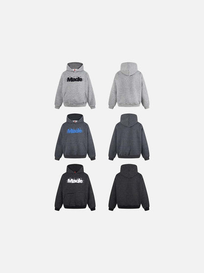 DAXUEN Oversized striped hoodie with 'Made' text