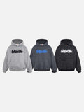 DAXUEN Oversized striped hoodie with 'Made' text