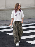 DAXUEN Oversized Abstract Symbol Graphic Tee — model photo