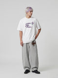 DAXUEN Oversized Abstract Symbol Graphic Tee — model photo