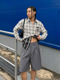 DAXUEN Medium grey wide-leg shorts with pleats and waistband — model photo