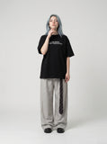 DAXUEN Oversized Slogan Print Tee — model photo