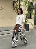 DAXUEN Oversized Metallic Oval Graphic Tee — model photo