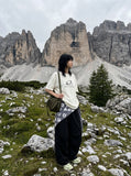 DAXUEN Oversized Metallic Oval Graphic Tee — model photo