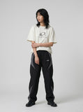 DAXUEN Oversized Metallic Oval Graphic Tee — model photo