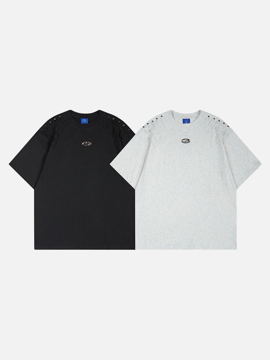 DAXUEN Short-sleeved T-shirt with metallic emblem and pleated details