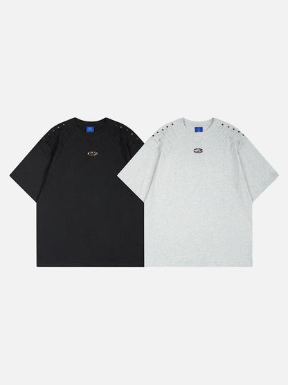 DAXUEN Short-sleeved T-shirt with metallic emblem and pleated details