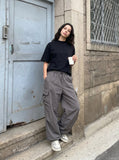 DAXUEN black mock neck oversized cotton tee — model photo