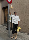 DAXUEN black mock neck oversized cotton tee — model photo
