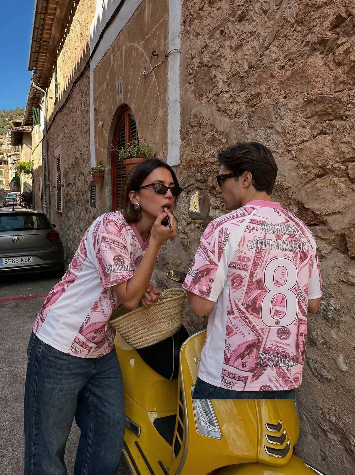 DAXUEN Oversized V-neck T-shirt with money print — model photo