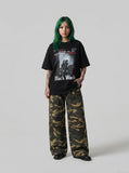 DAXUEN black oversized monochrome desk scene graphic tee — model photo