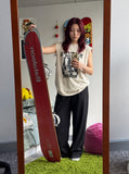 DAXUEN beige sleeveless woman's face graphic tee — model photo