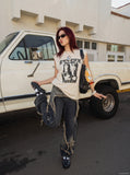 DAXUEN beige sleeveless woman's face graphic tee — model photo