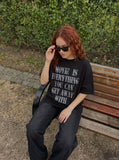 DAXUEN Oversized short-sleeved t-shirt with distressed text print — model photo