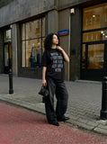 DAXUEN Oversized short-sleeved t-shirt with distressed text print — model photo