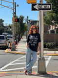 DAXUEN Oversized short-sleeved t-shirt with distressed text print — model photo